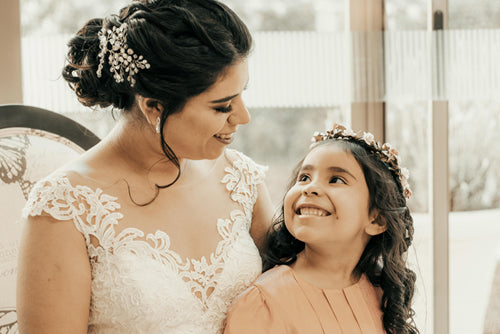 The bride and Flower girl wear beautiful accessories